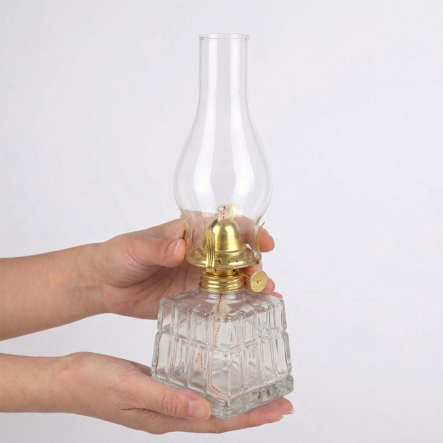 Brilagi - Lampe à pétrole MERLIN transparente/dorée