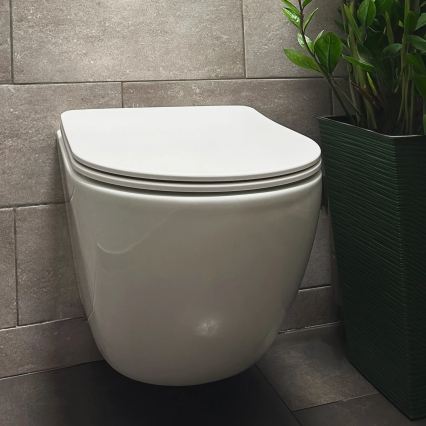 REA-C1259 - WC suspendu CARLO MINI TORNADO RIMLESS avec abattant, en céramique finition blanc brillant