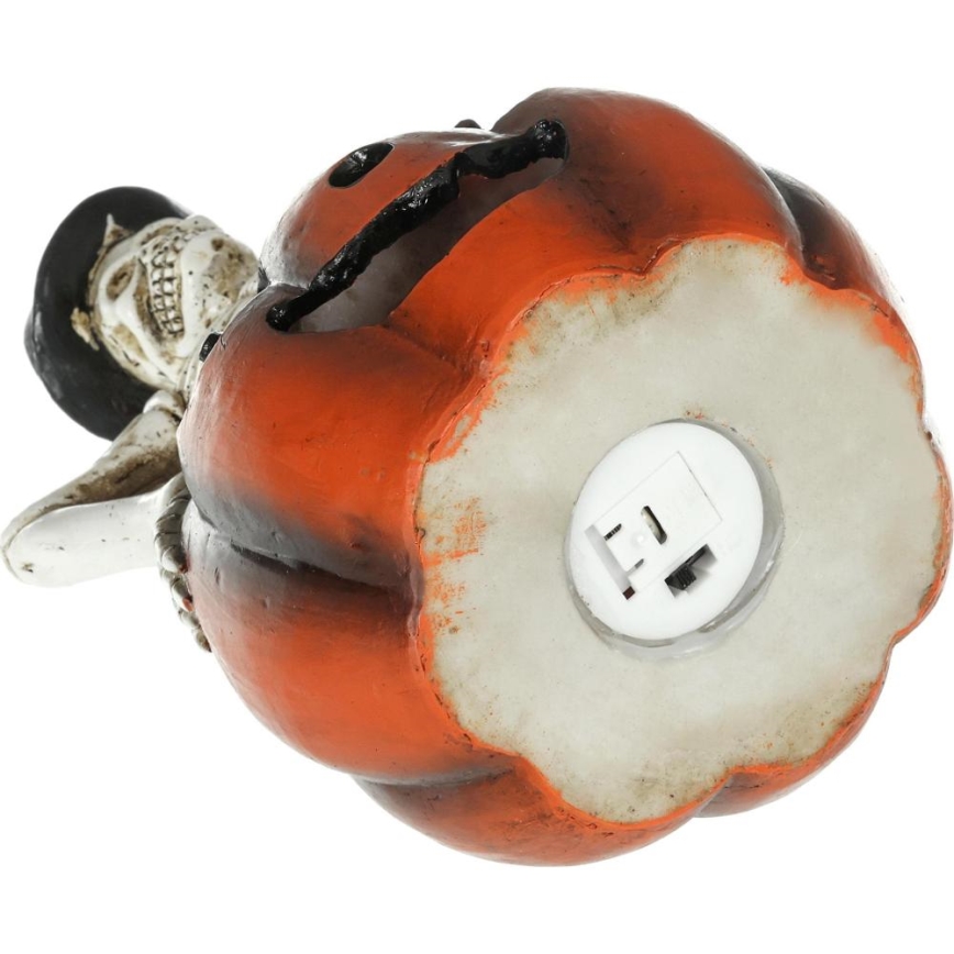 Décoration HALLOWEEN LED/2xLR44/blanc chaud squelette dans une citrouille résine