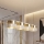 Suspension sur câble LUX 4xE27/15W/230V blanc/doré